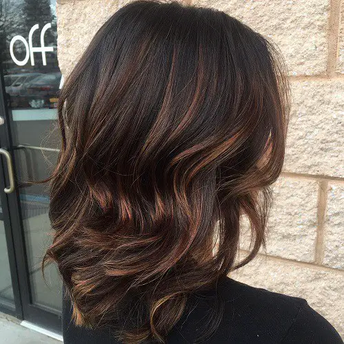 Dark brown hair with caramel highlights